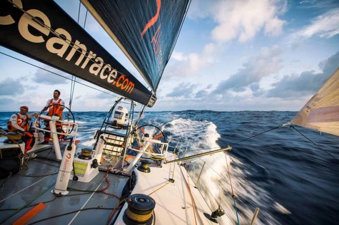 Onboard Team Alvimedica – Watch partners Mark Towill (driving) and Alberto Bolzan (sitting) sailing downwind near sunset - Volvo Ocean Race 2015 ©  Amory Ross / Team Alvimedica